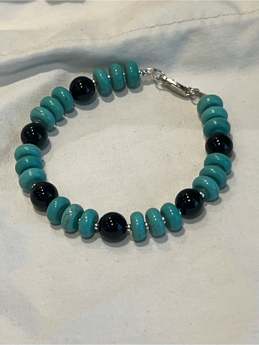 Magnesite and black onyx sterling silver bracelet